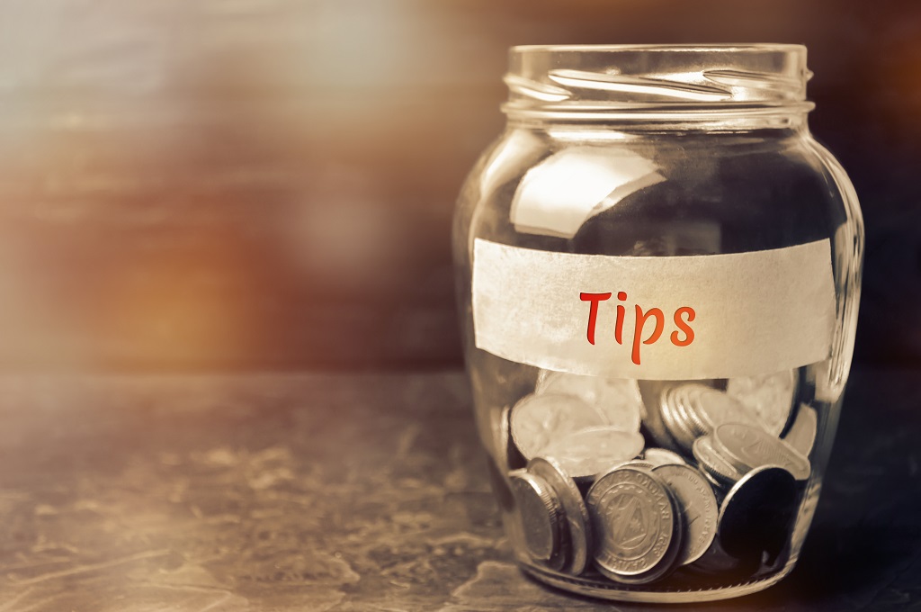 Tip jar showing tips left for staff