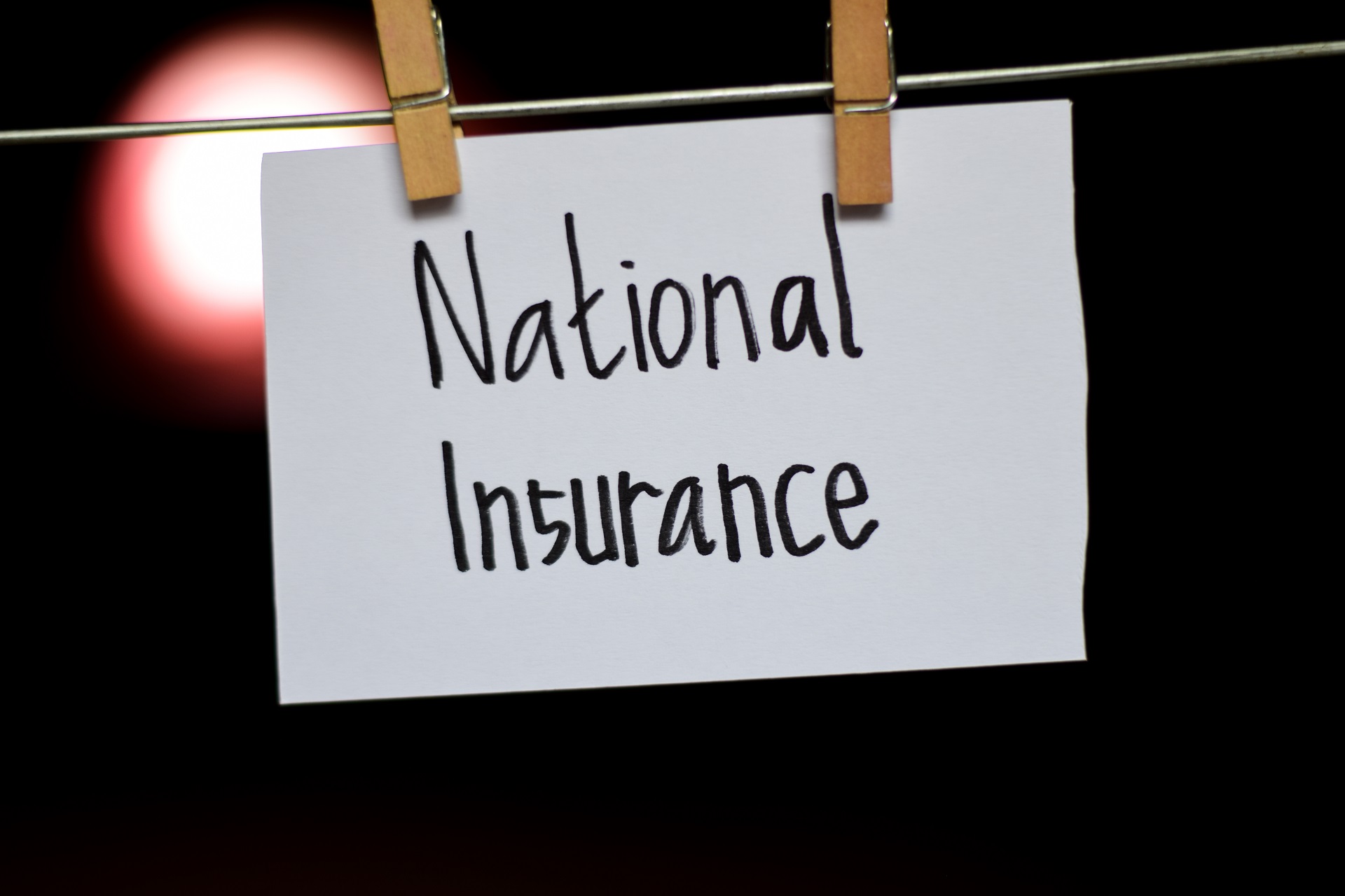 National Insurance sign pegged to a washing line